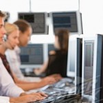Stock Traders Working At Computers